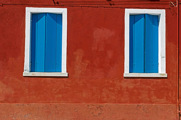 Background with building facade in Burano, Italy