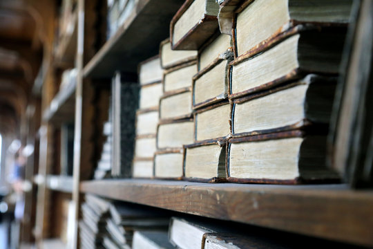 Old books on library shelves