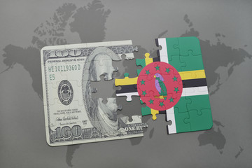 puzzle with the national flag of dominica and dollar banknote on a world map background.