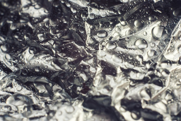 Abstraction of water drops on foil.