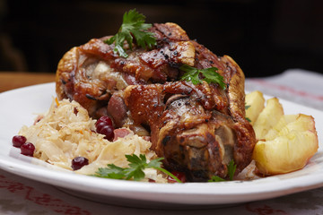 fried pork knuckle with potatoes and cabbage