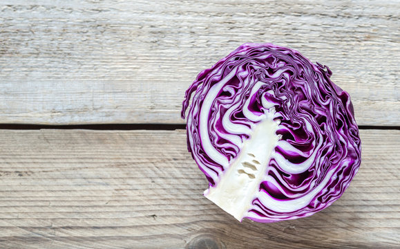 Red cabbage on the wooden background