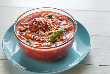 Portion of minestrone soup with meatball