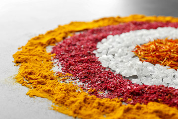 Rings of different spices on gray background