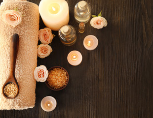 Beautiful spa composition with flowers on wooden background