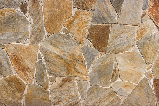 masonry slate facade wall background with cement joints antique