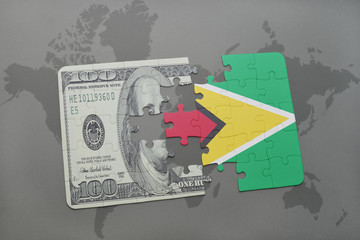 puzzle with the national flag of guyana and dollar banknote on a world map background.