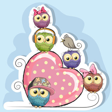 Five Owls is sitting on a heart