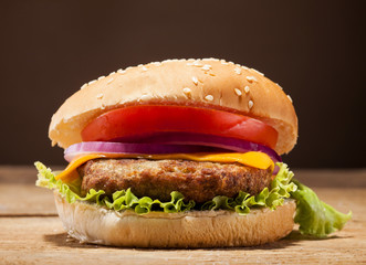 Fresh burger on wooden background