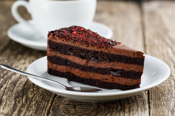 Tasty vegetarian chocolate dessert on wooden table for celebrati