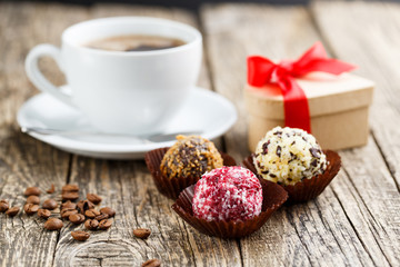 Delicious vegetarian truffle candies on wodden table.