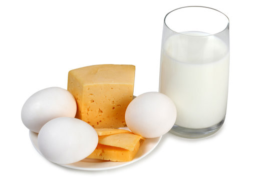 Cheese with milk in glass on white background