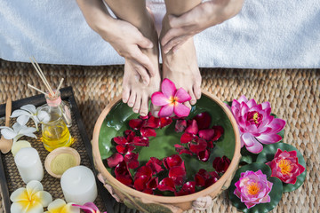 Female feet at spa pedicure procedure..