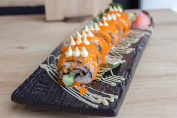 Sushi California rolls on black plate - Japanese food