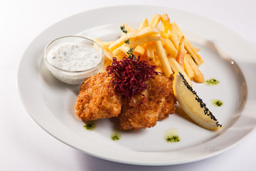 dish of meat in batter and fried potatoes