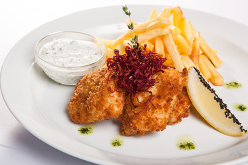 dish of meat in batter and fried potatoes