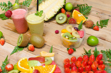 Assortment of tropical exotic fruits with smoothie and fresh jui
