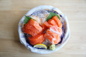 salmon sashimi on wood background japanese food