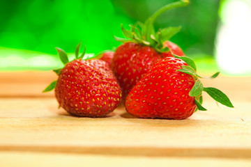 few berries fresh strawberries on a blurred background