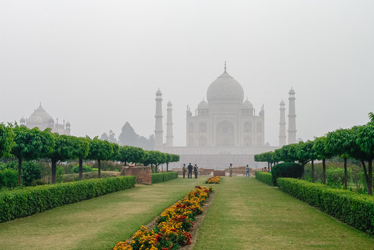 Taj Mahal view in morning fog from across the Mehtab Bagh or The Moonlight Garden, Agra, India