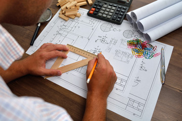 Architect sketching a construction project, view from the top