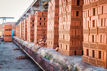 bricks in the paletakh lie in a warehouse