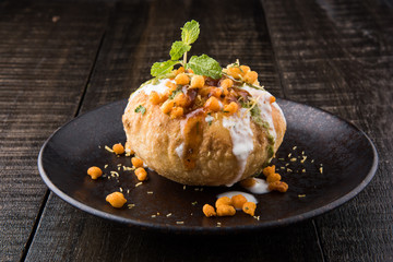 Rajasthani Shahi Raj Kachori, stuffed katchori with potato and sprout filling and served with curd, chutney and sev © StockImageFactory