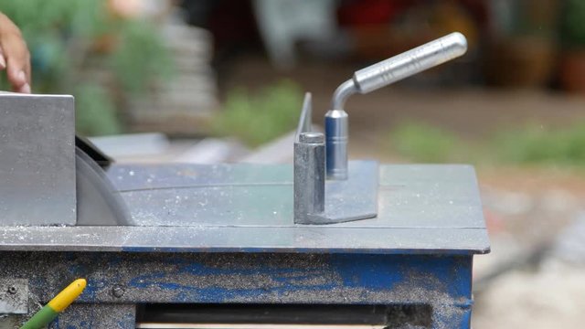 4k of Professional Worker cutting aluminium with grinder blade