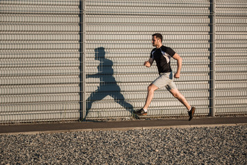 Full length portrait of athletic man running