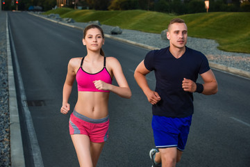 Close-up portrait of athletic couple running