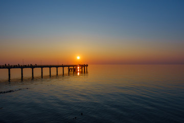 Naklejka na ściany i meble Sunset on Baltic sea coast at summer