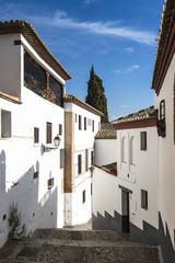 Fototapeta na wymiar Albaicin district, narrow hilly streets of Granada. Andalusia, Spain