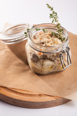 Roast in the pot on a wooden plate