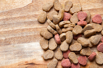 The image of dog food on a wooden table
