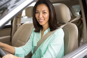 Asian woman driving.