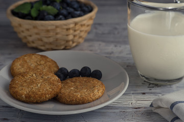 Oatmeal cookies close up with cup of milk
