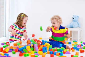 Kids playing with colorful blocks.