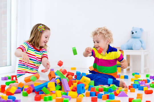 Kids playing with colorful blocks.