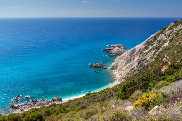 Fototapeta na wymiar Rocks and blue waters near Petani Beach, Kefalonia, Ionian Islands, Greece