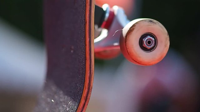 young skateboarder legs skateboarding at skatepark