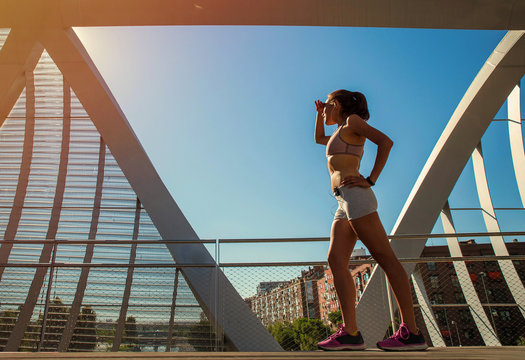 Female Runner Scanning The Horizon