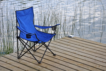 Blue beach chair on dock