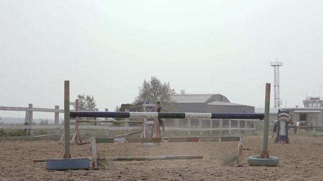 Girl jumping on a horse