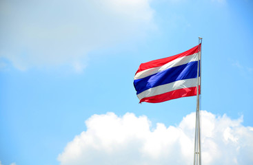 Thai flag against blue sky