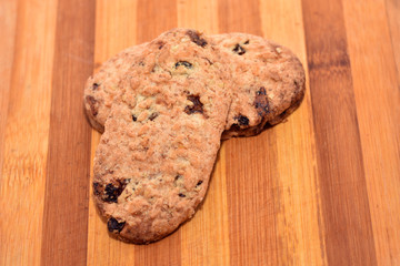 Crunchy biscuits on wood background