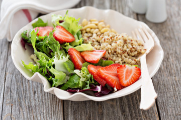 Quinoa salad with strawberries and greens