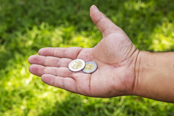 Hand with coins