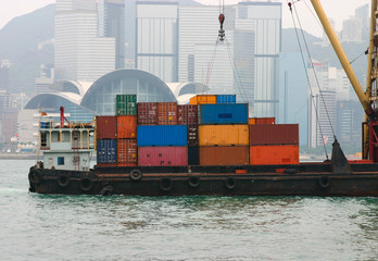 Naklejka premium Container Shipping on a barge in Victoria Harbour - Hong Kong