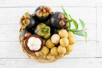 Mangosteen and Longkong on White Wooden Background