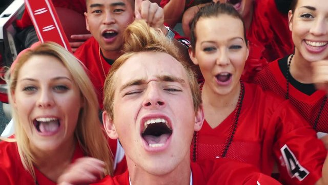 Tailgate: Group Of Excited Fans Yelling For Video Selfie